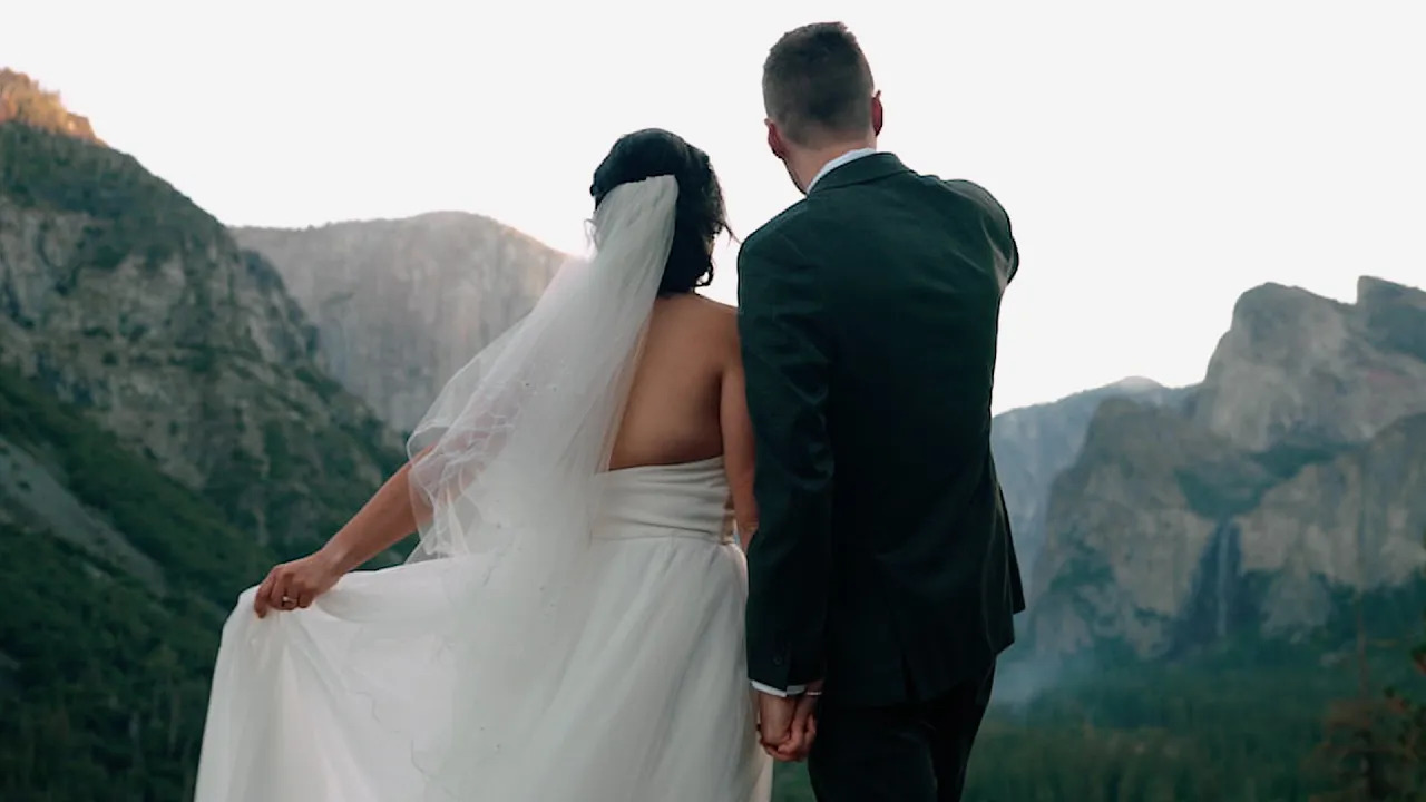 Bride and groom viewing the Yosemite Valley in Yosemite National Park