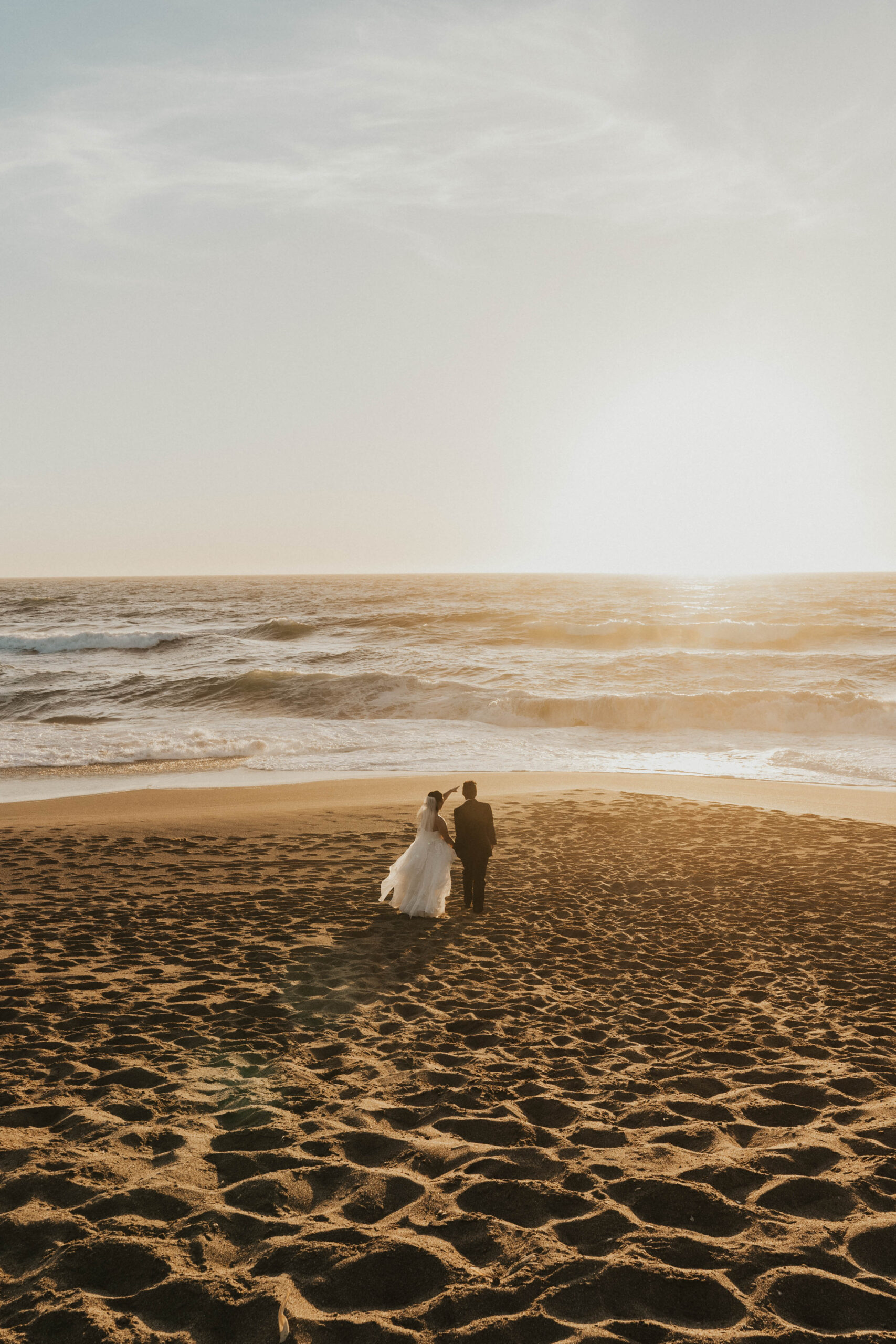 Newlywed couple on the beach at Point Reyes National Seashore after San Francisco city hall elopement